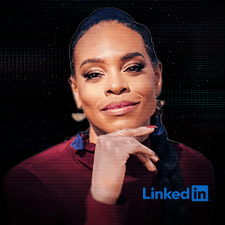 Smiling man in a dark blazer and purple striped shirt against a dark digital background.