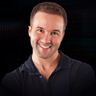 Smiling woman with short dark hair wearing small hoop earrings and a black beaded necklace against a dark background.