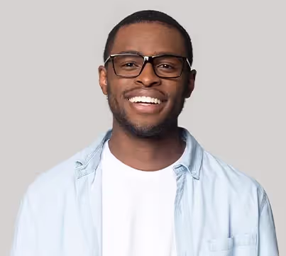 A man wearing glasses and a blue shirt.
