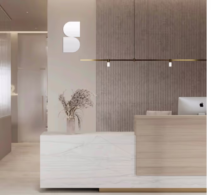 A reception area with a marble counter top.