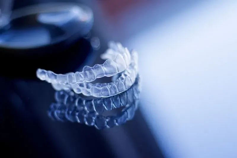 A clear brace sitting on a glass table