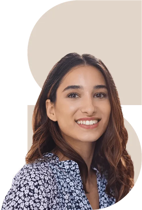 A woman with long hair smiling for a picture.