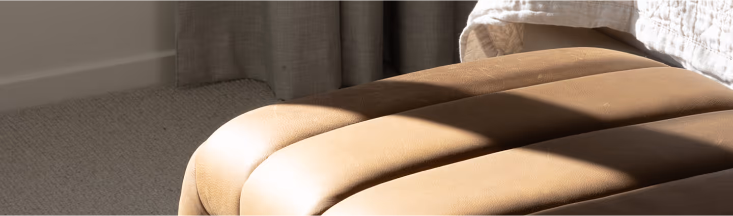 Bedroom furniture package with leather ottoman.