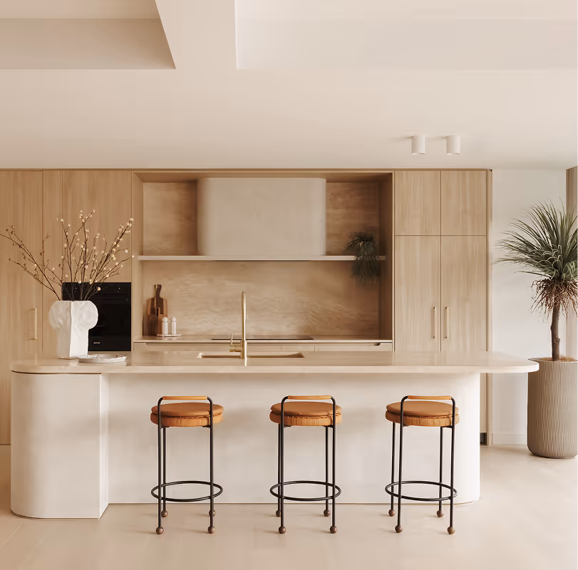 Minimalist bedroom with beige bedding, a black modern lamp on a wooden nightstand, and a potted plant near a sheer curtain window.