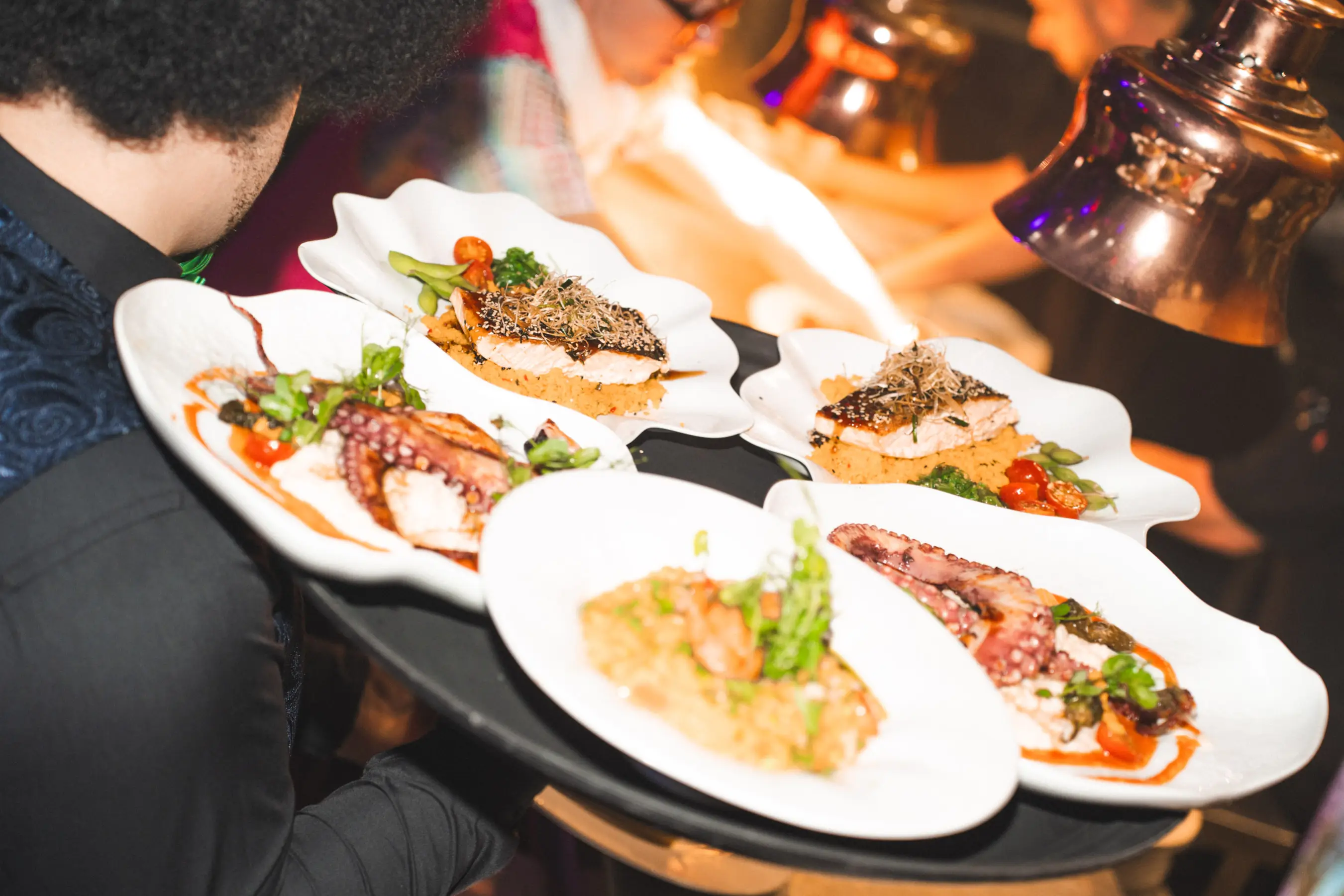 Salmon and starters served during Tabana Night Fever dinner show