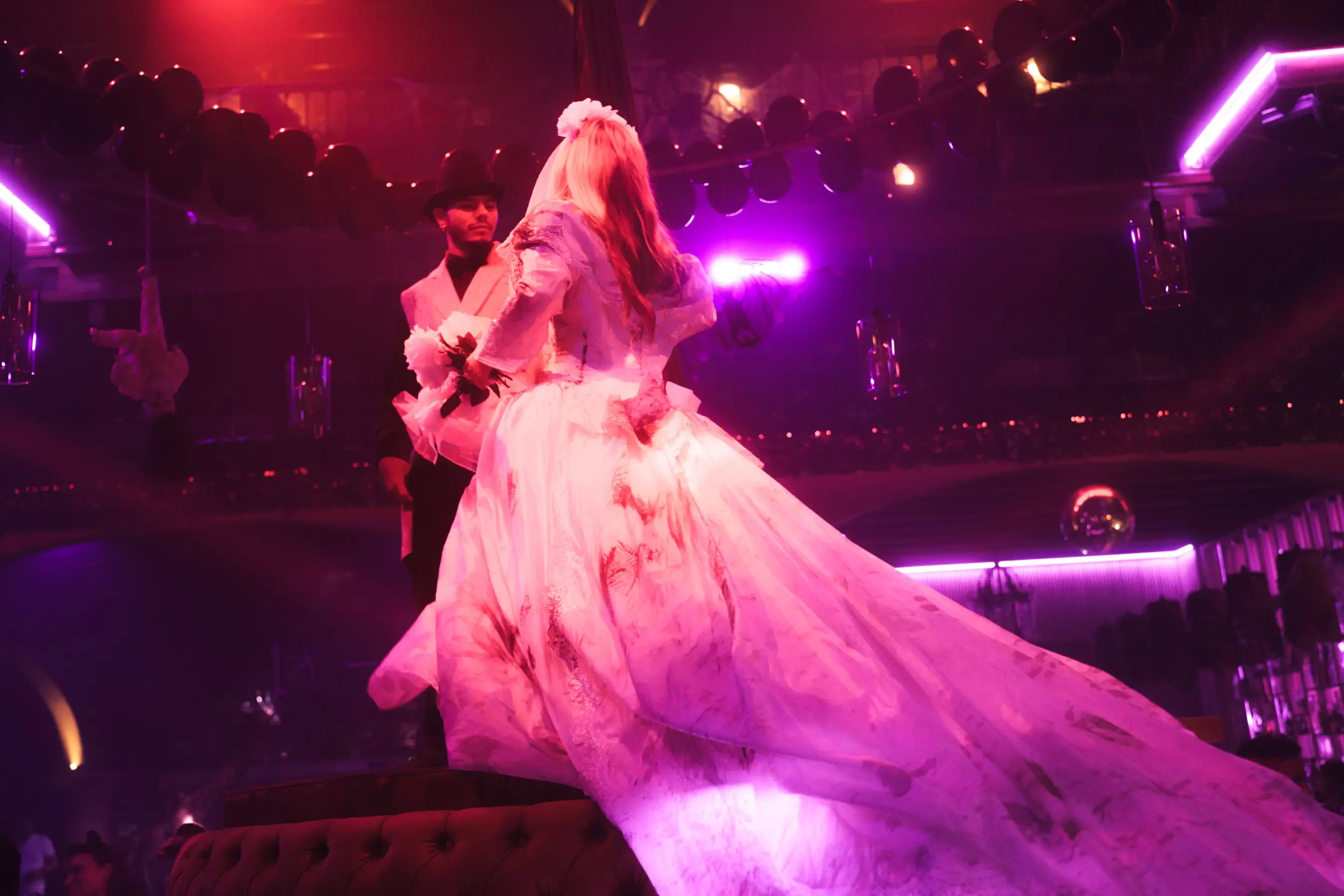 Guests dancing under Tabana’s glowing sign during the Halloween party in Playa de Palma.