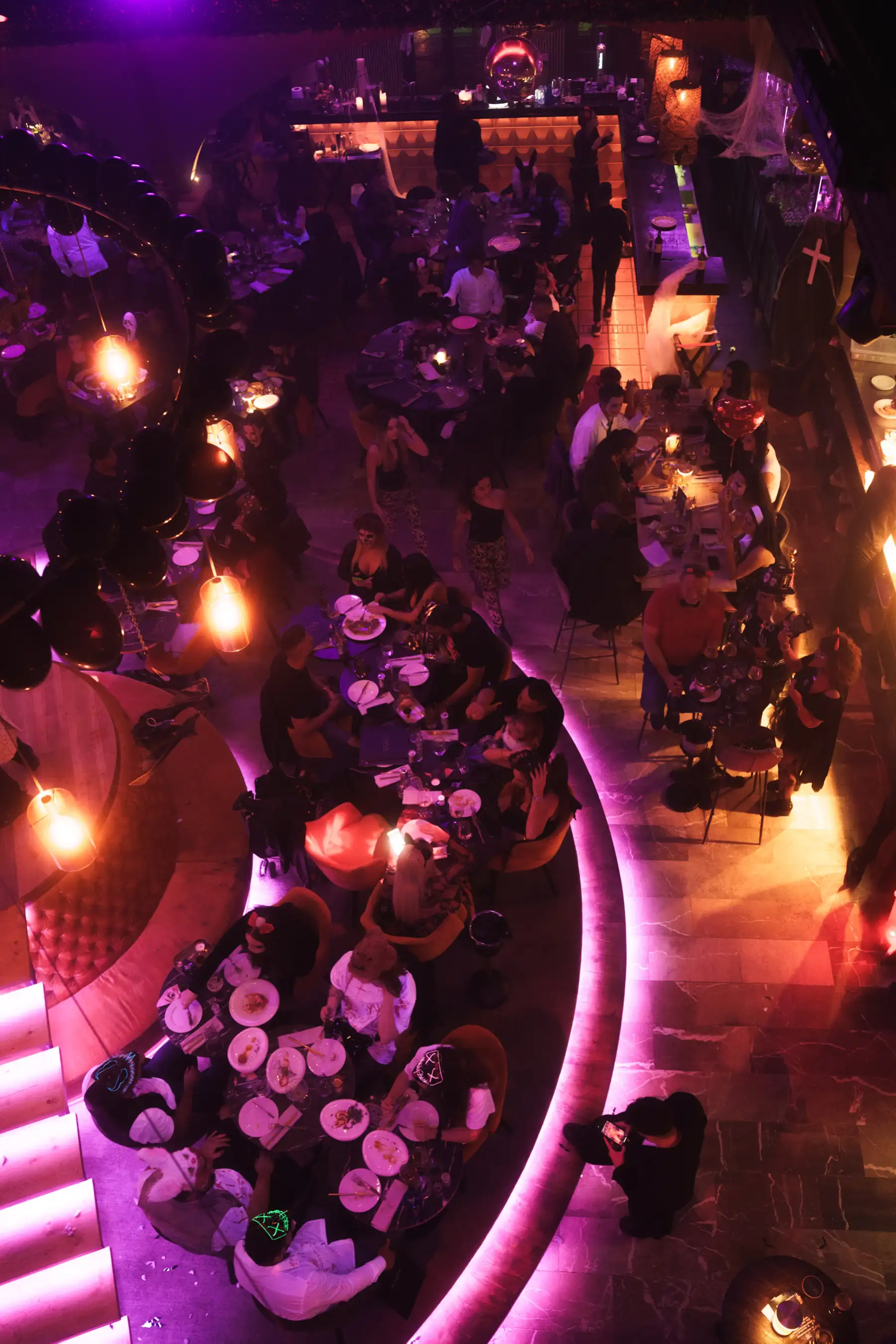Guests in Halloween costumes dining by candlelight at Tabana in Playa de Palma.