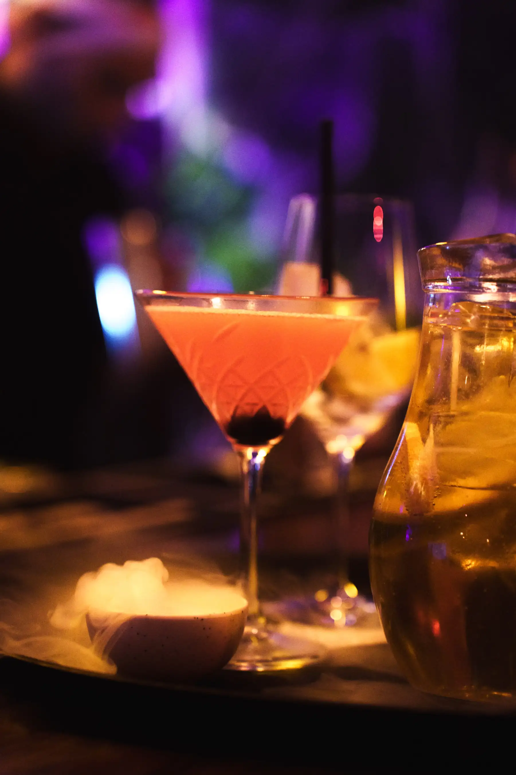 Close-up of Halloween cocktails with smoke effect served at Tabana Grill & Nightlife.