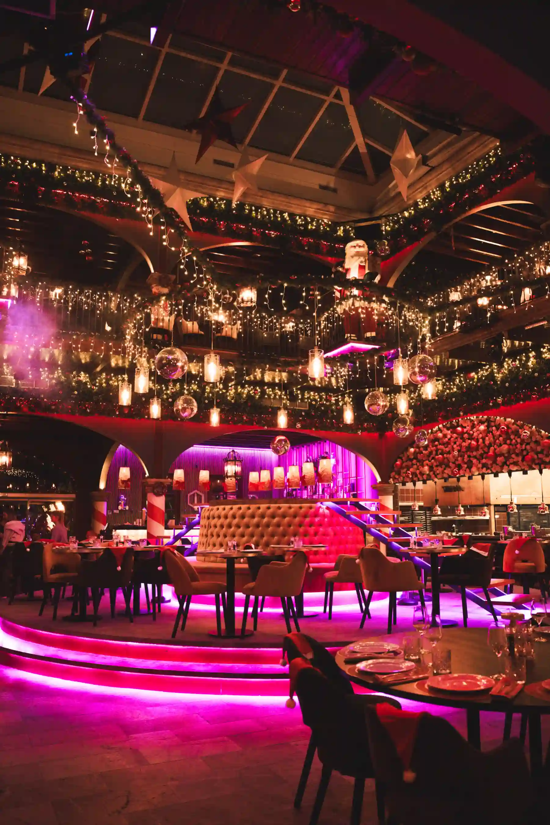 Tabana interior filled with Christmas lights, Santa décor and party atmosphere during Dirty Santa.