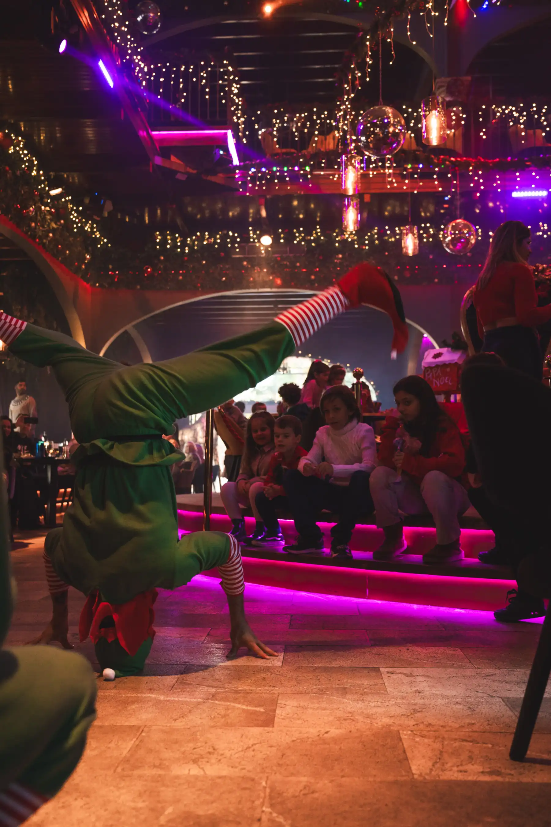 Guests enjoying live entertainment and festive dining at Santa’s Lunch event in Mallorca.