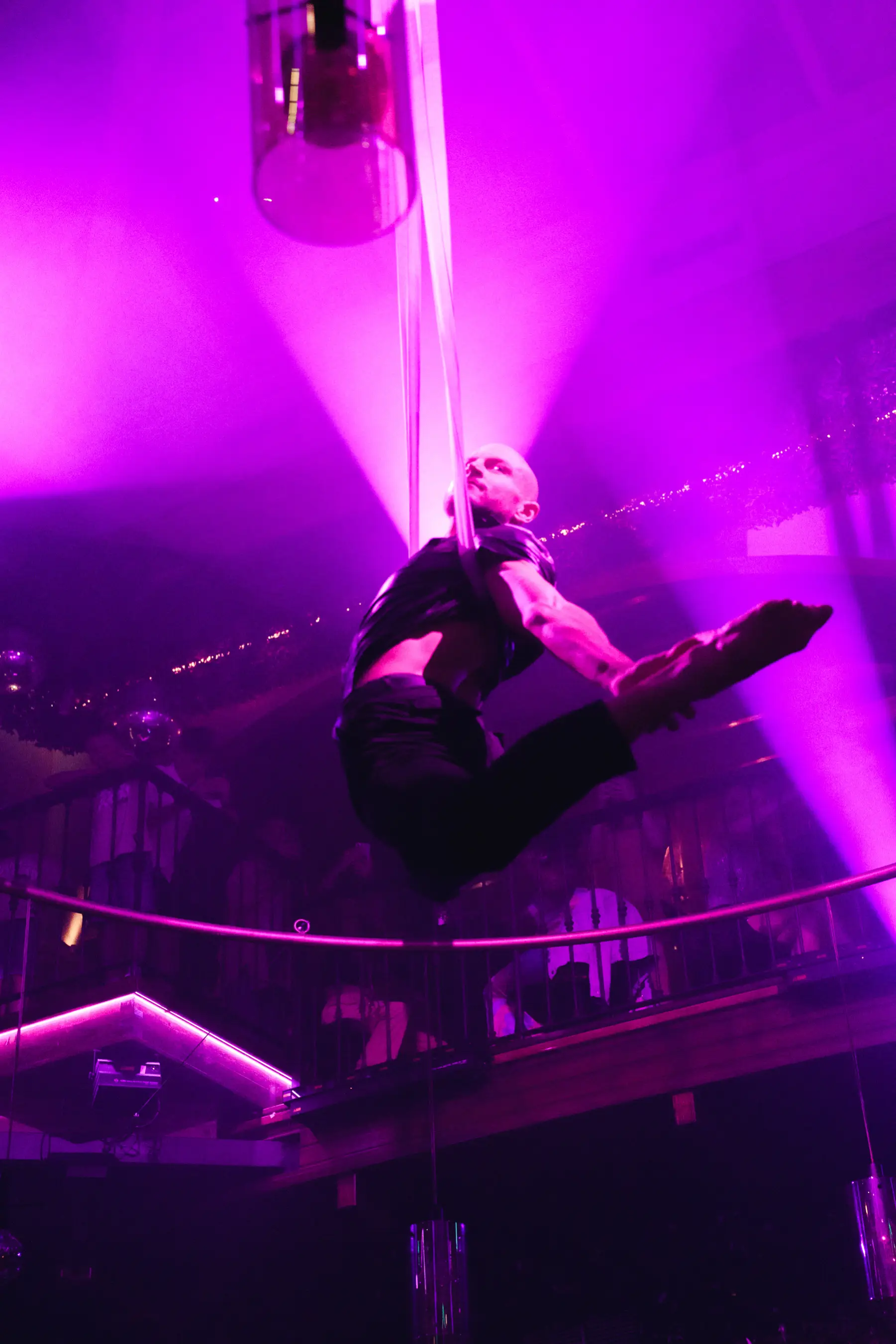 Dancers in tropical-themed costumes on stage during Miami Heatwave at Tabana Mallorca.