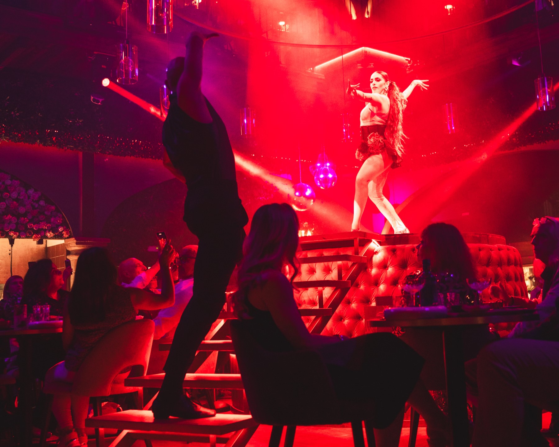 Live entertainment at Tabana with guests seated at their tables during dinner, creating a complete evening experience