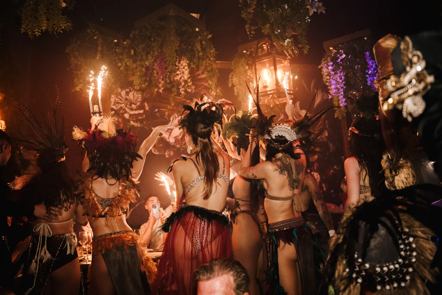 Live performers with sparklers moving through the dining room during a dinner show at Tabana in Playa de Palma, Mallorca
