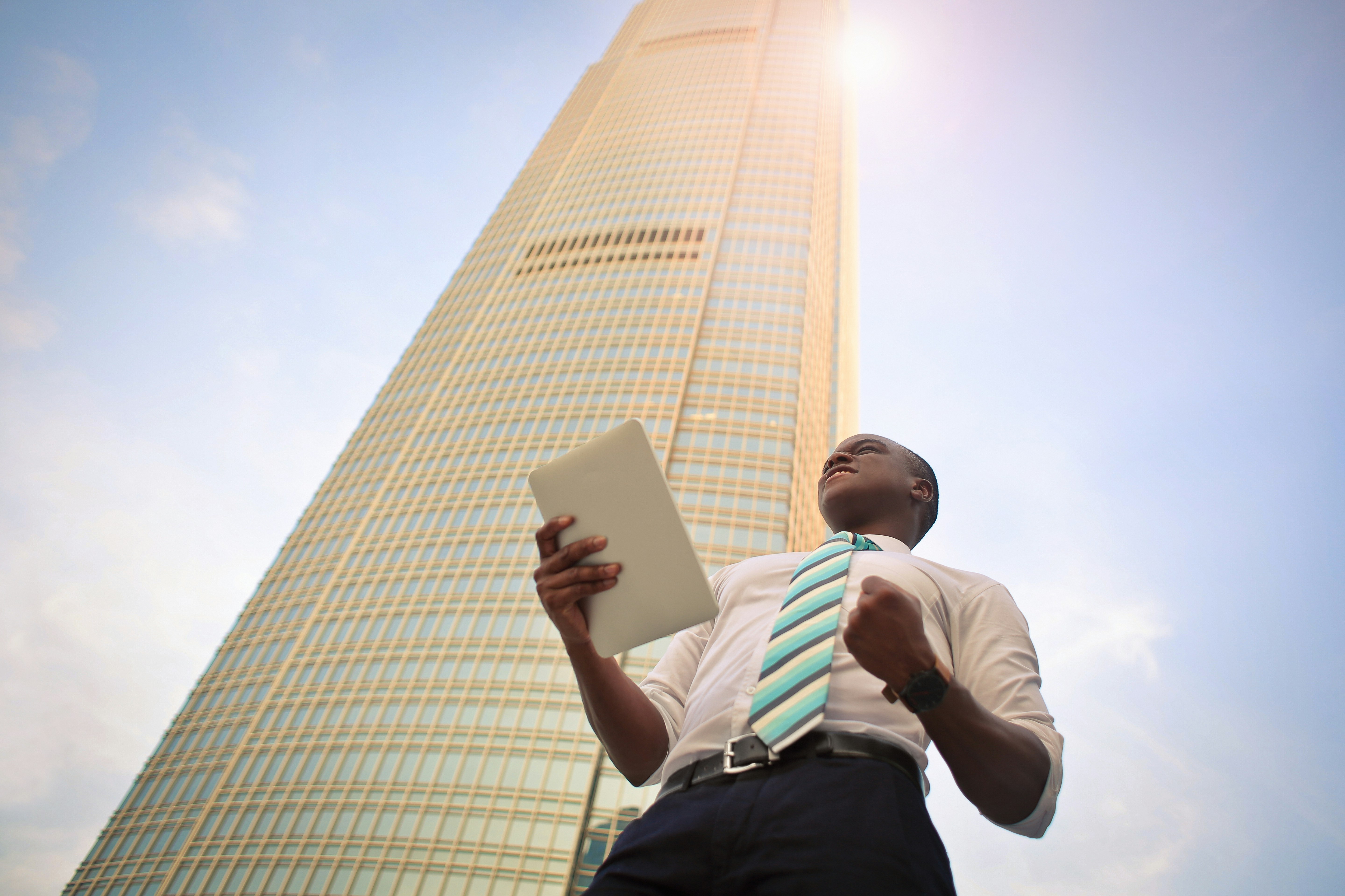 Building with a man and tablet