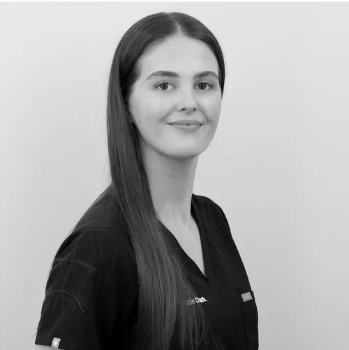 Portrait of a smiling female dental team member