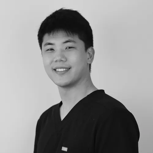 Portrait of a smiling male dental team member in uniform