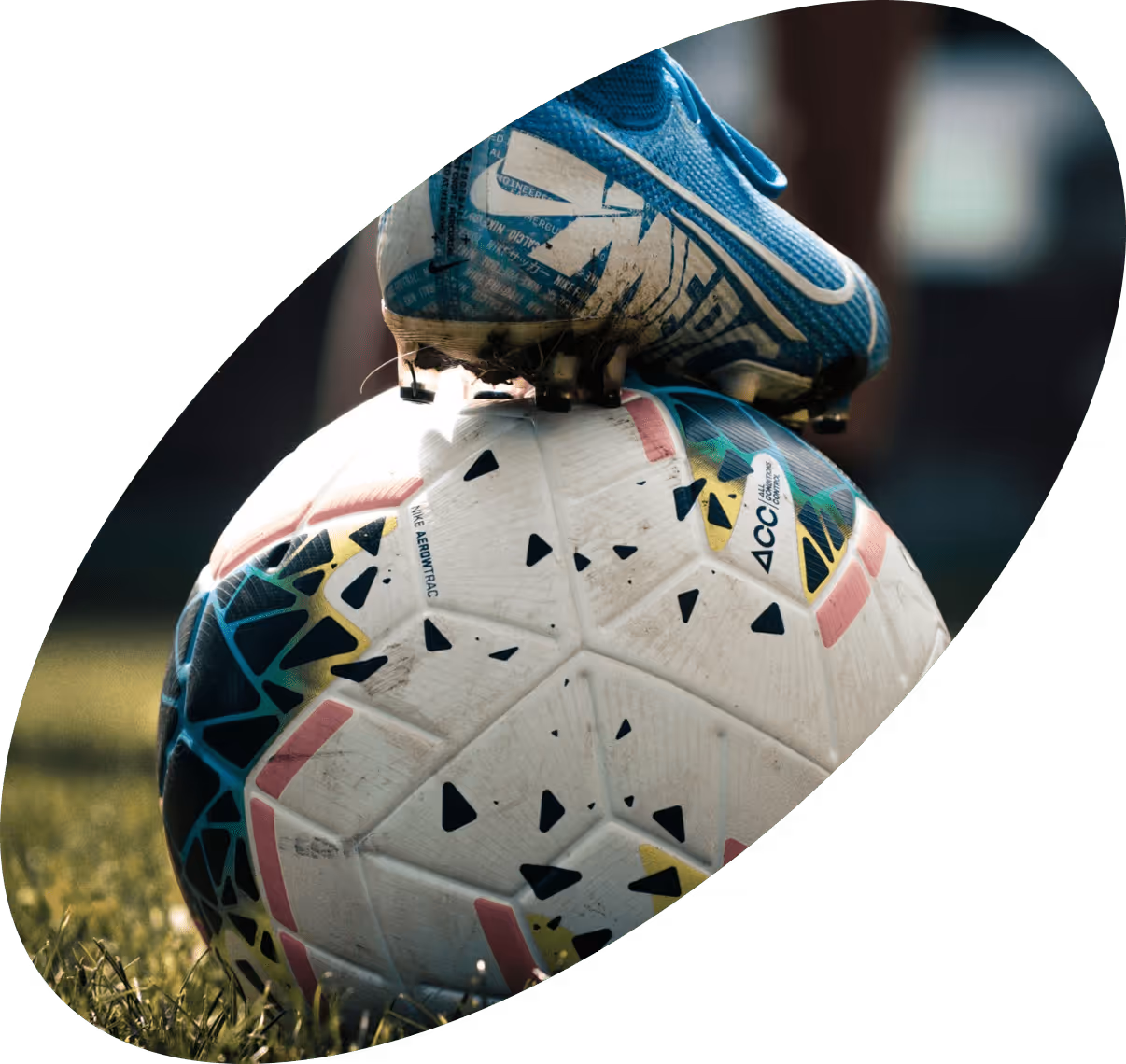 Soccer ball with a cleat on top