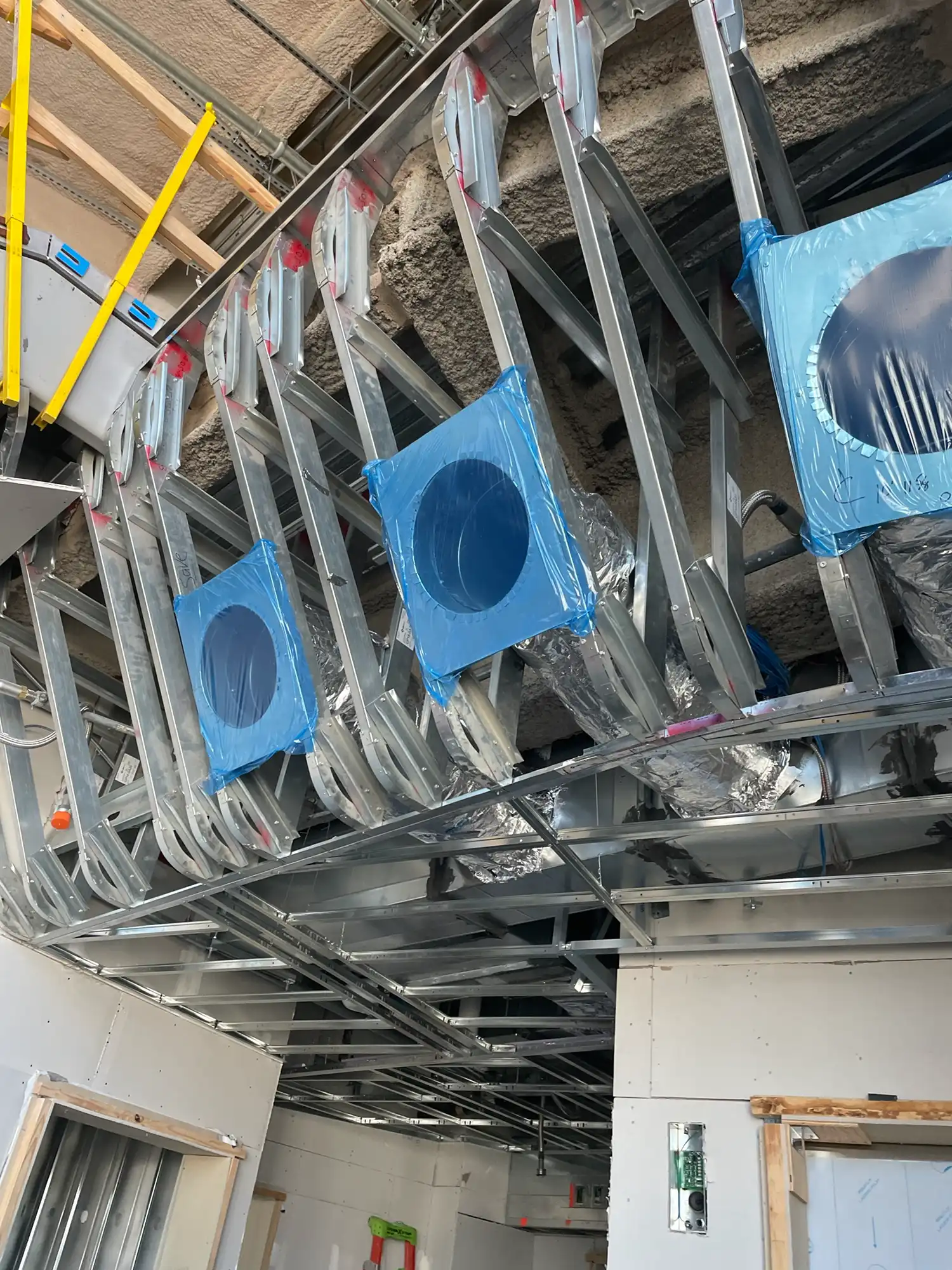 Curved truss framing system fabricated for Logan Terminal D Boston interior geometry