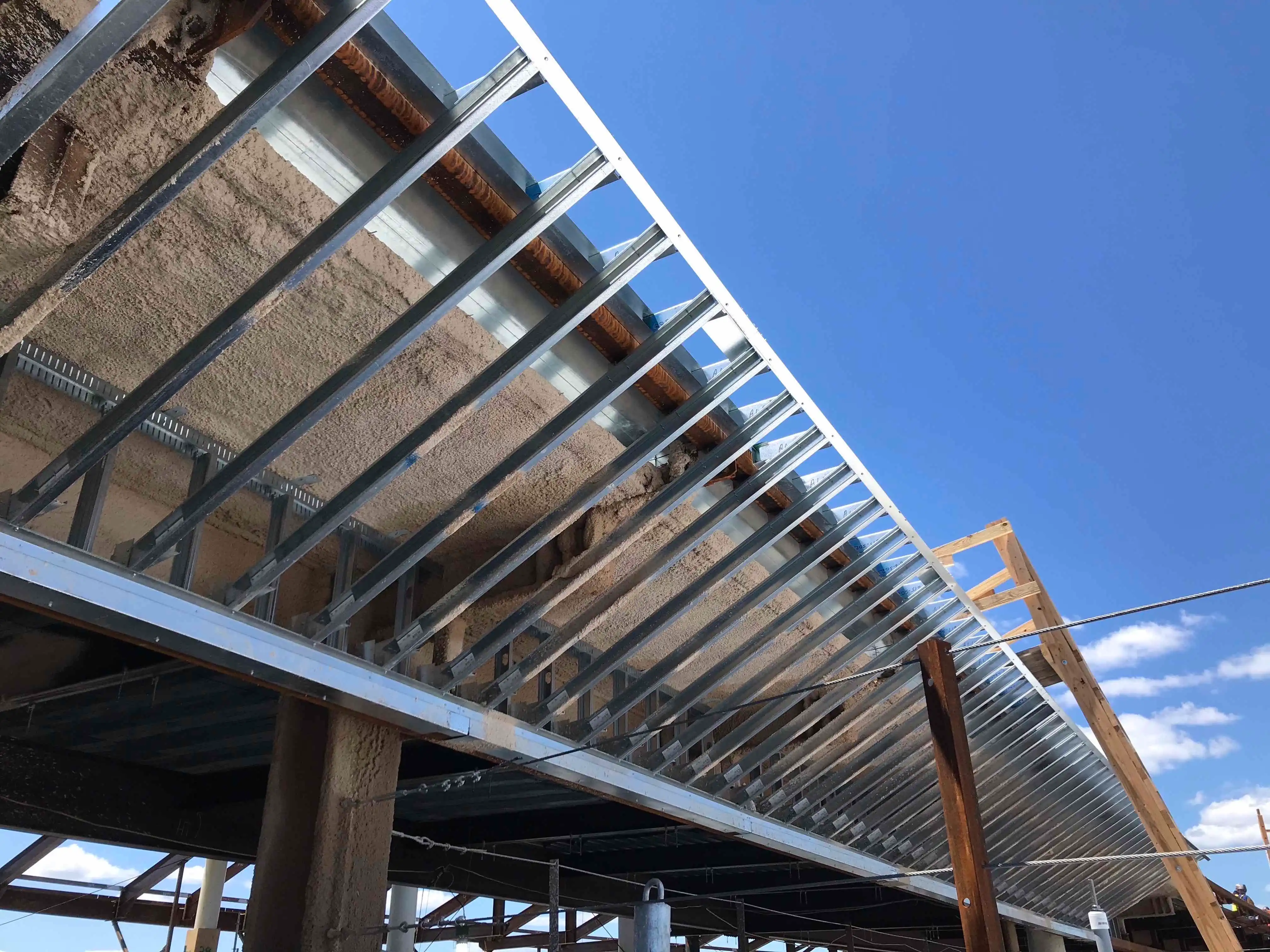 Prefabricated roof and soffit framing assemblies fabricated for complex freeform geometry at Logan Terminal D Boston