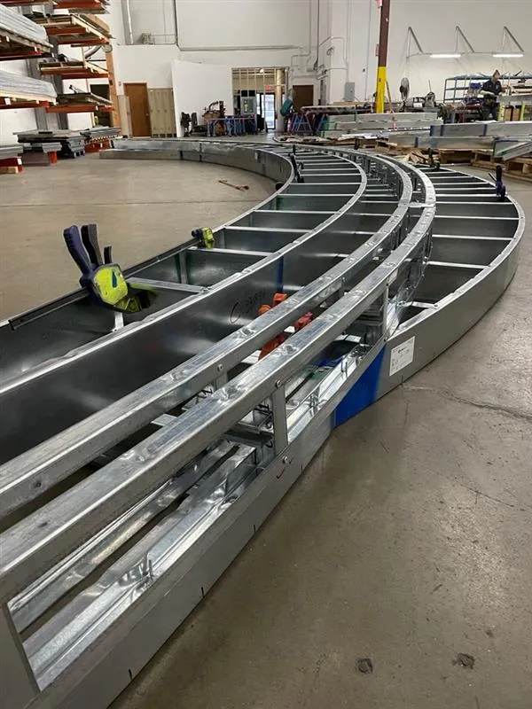 Completed curved feature soffit at Redford Library constructed using prefabricated cold formed steel panel system