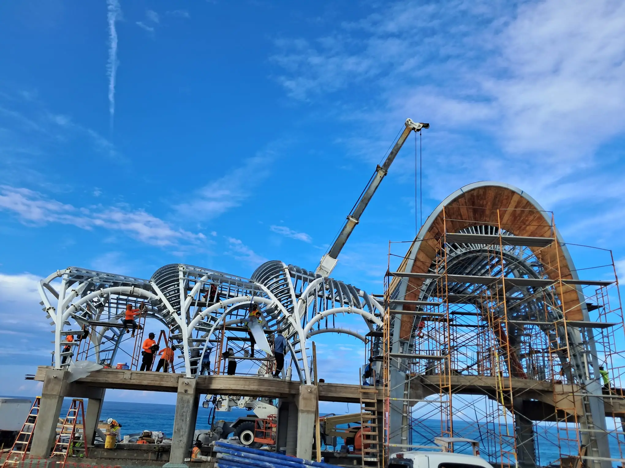Compound curved steel framing system forming repeating roof vaults at Paradise Island Pool Pavilion