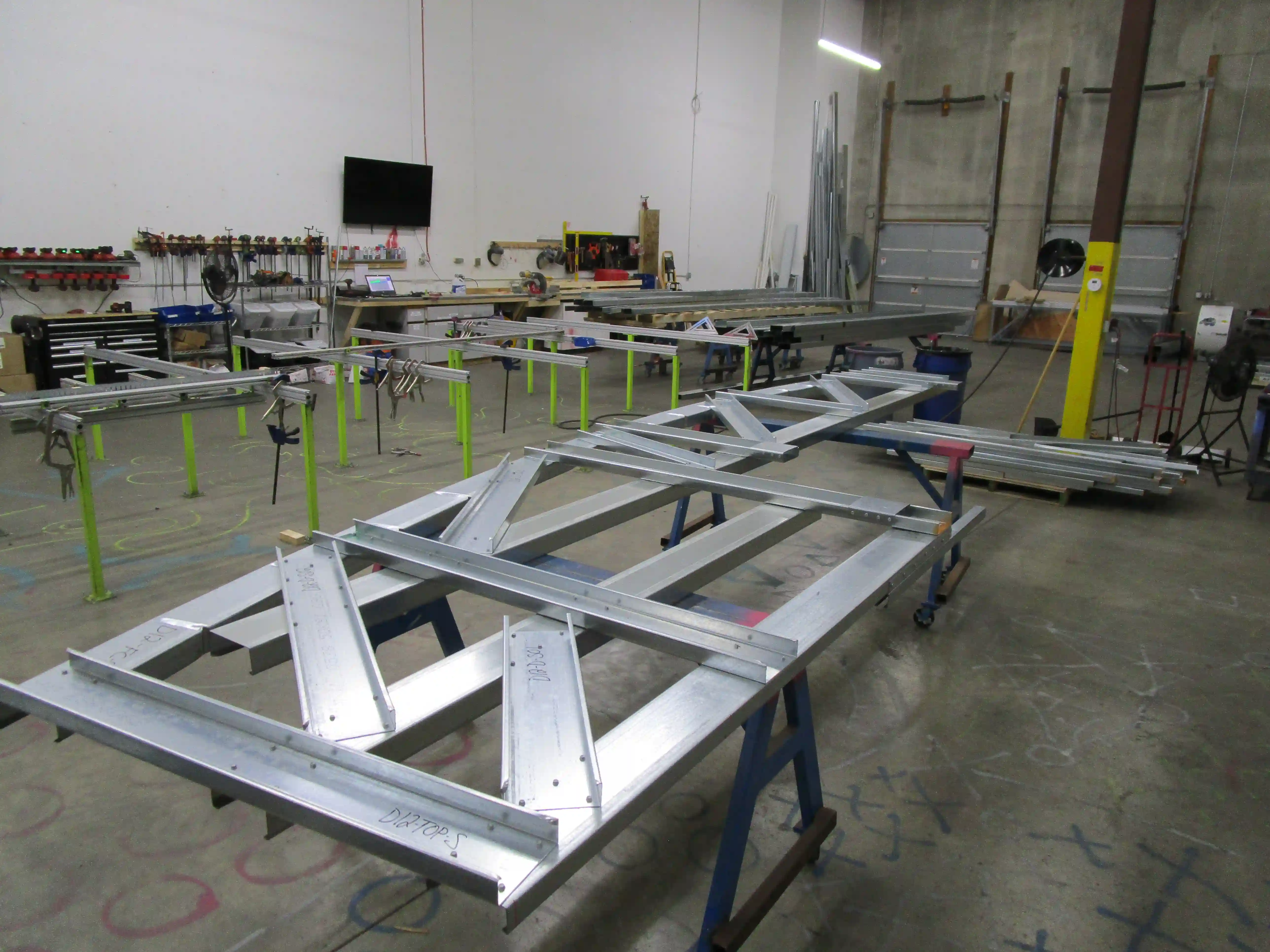 Shop fabricated cold formed steel trusses built as pre-engineered assemblies for the Cenovus Energy Hub curved façade