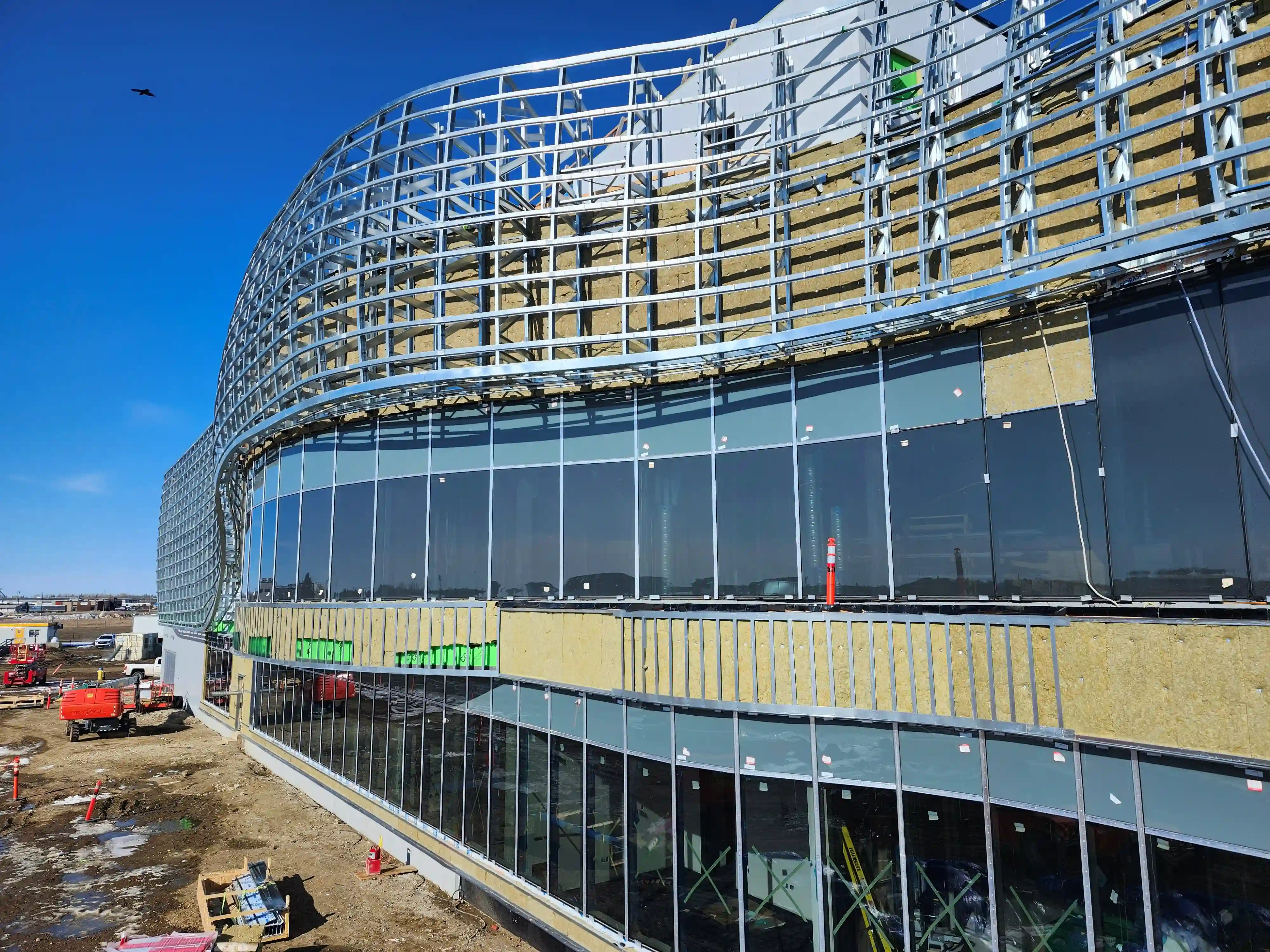 Trusses installed with hat channel spanning to reduce truss count
