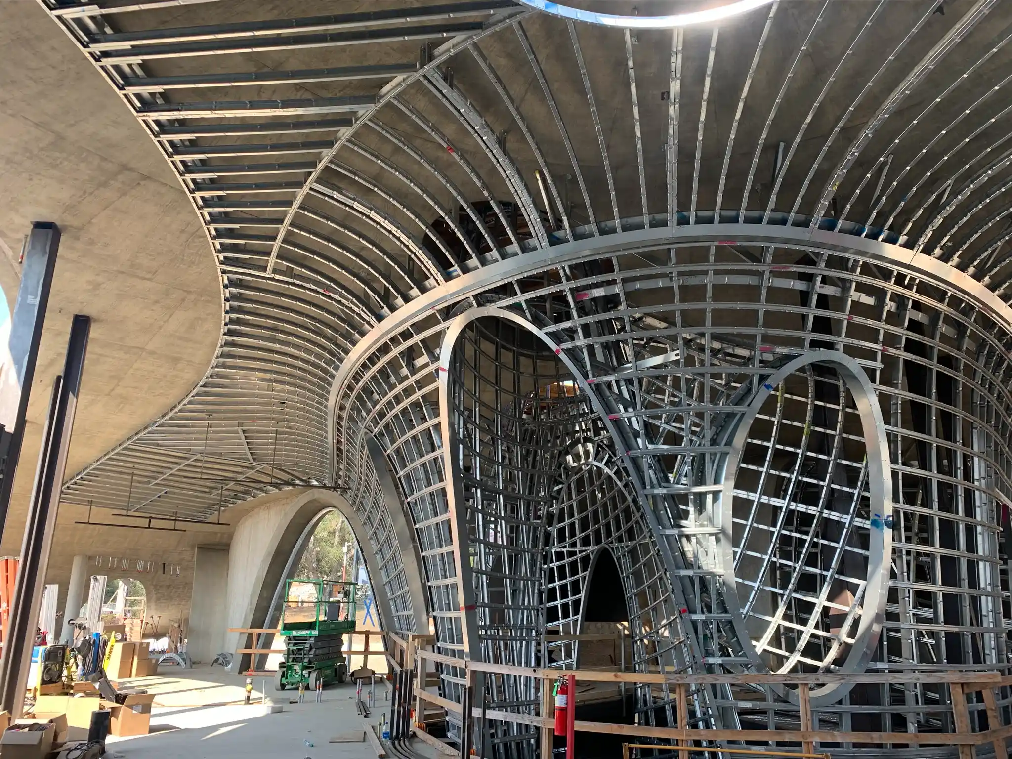 Large scale curved steel framing system with intersecting arches and compound geometry during Hill House construction