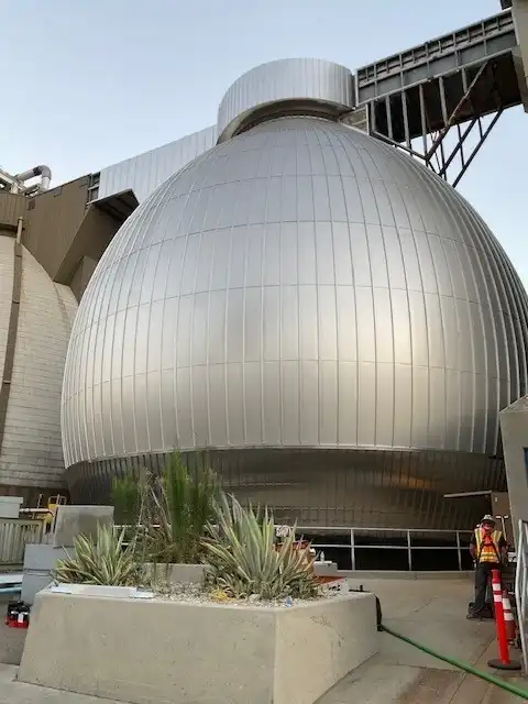 Stainless steel metal panel cladding installed over spherical digester structure at LA Terminal wastewater treatment facility