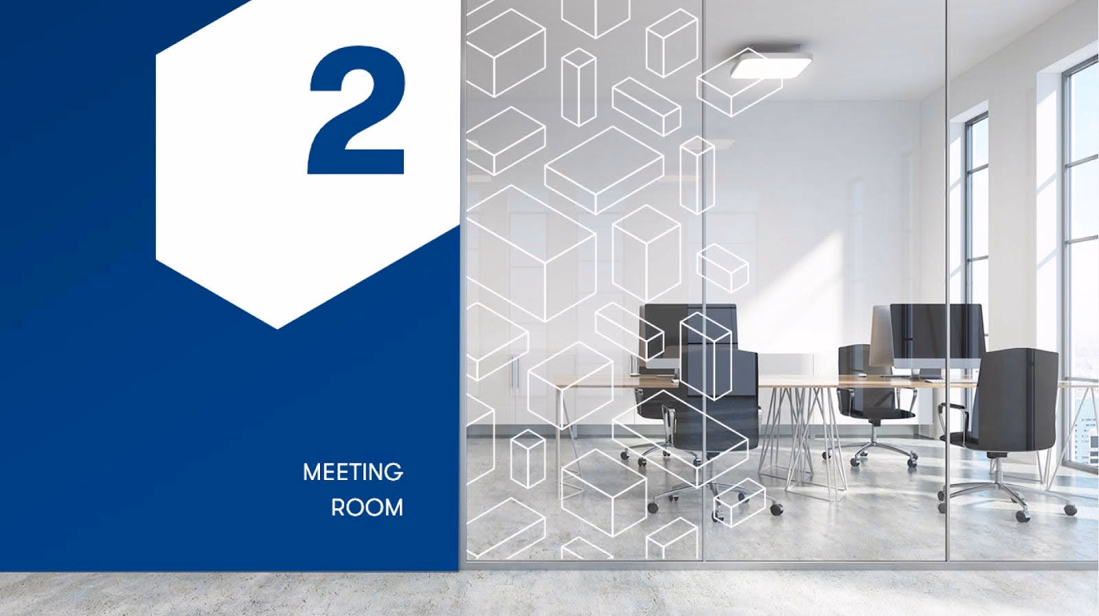 Glass-walled modern meeting room with black office chairs and computers, marked as Room 2.