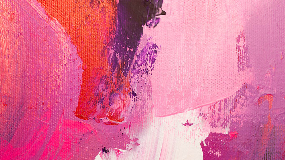 Close-up of vibrant abstract painting with textured brushstrokes in pink, purple, red, and white hues on canvas.