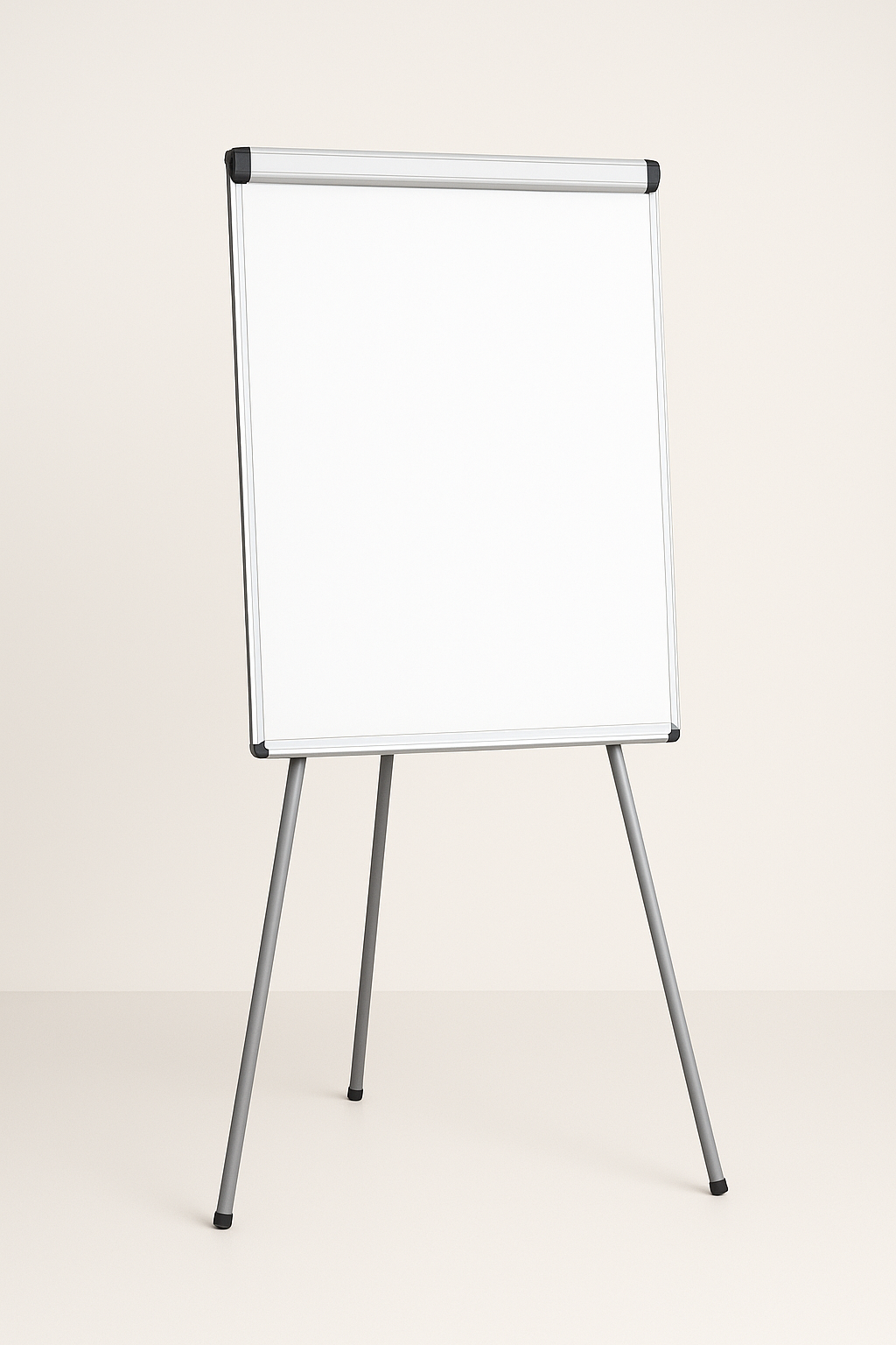 Blank white flip chart easel with silver legs against a plain light background.