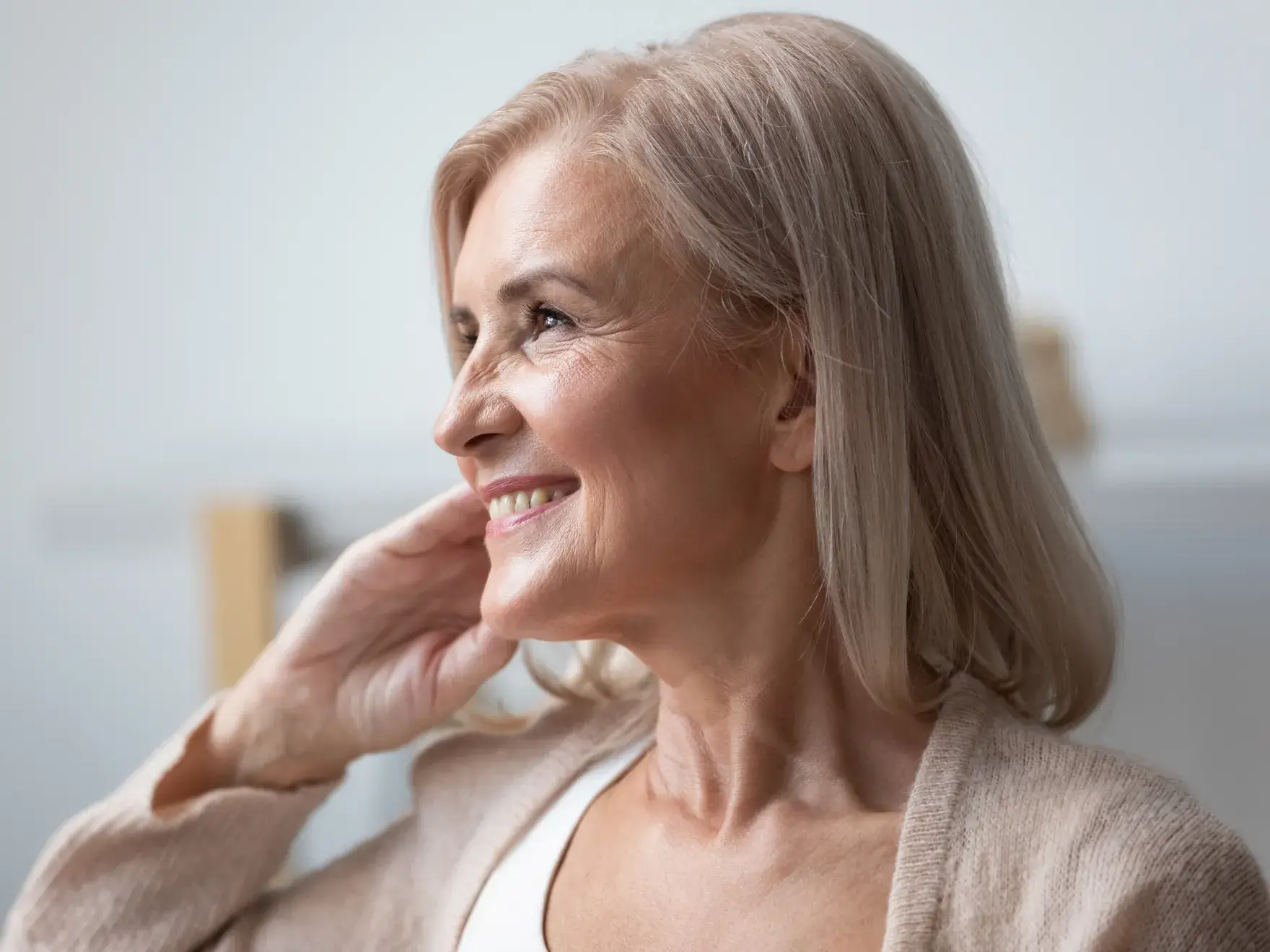 An older woman with a smile on her face.