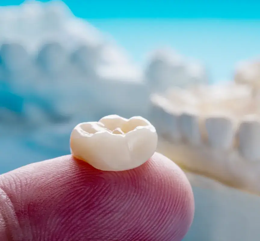 A tooth that has been placed on a finger.