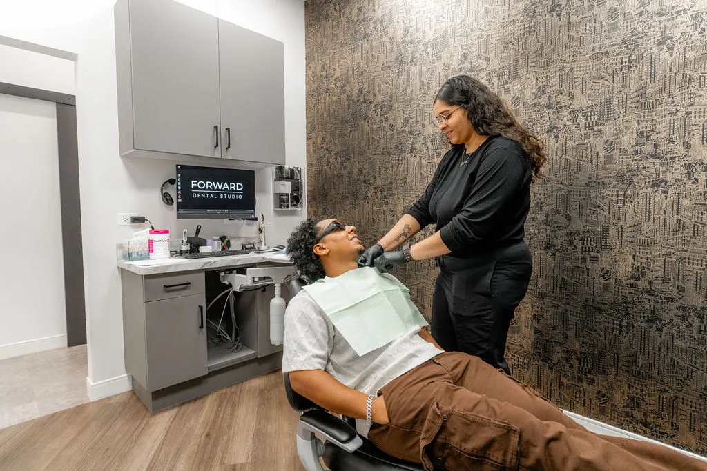 Dr Luis Peralta with a patient