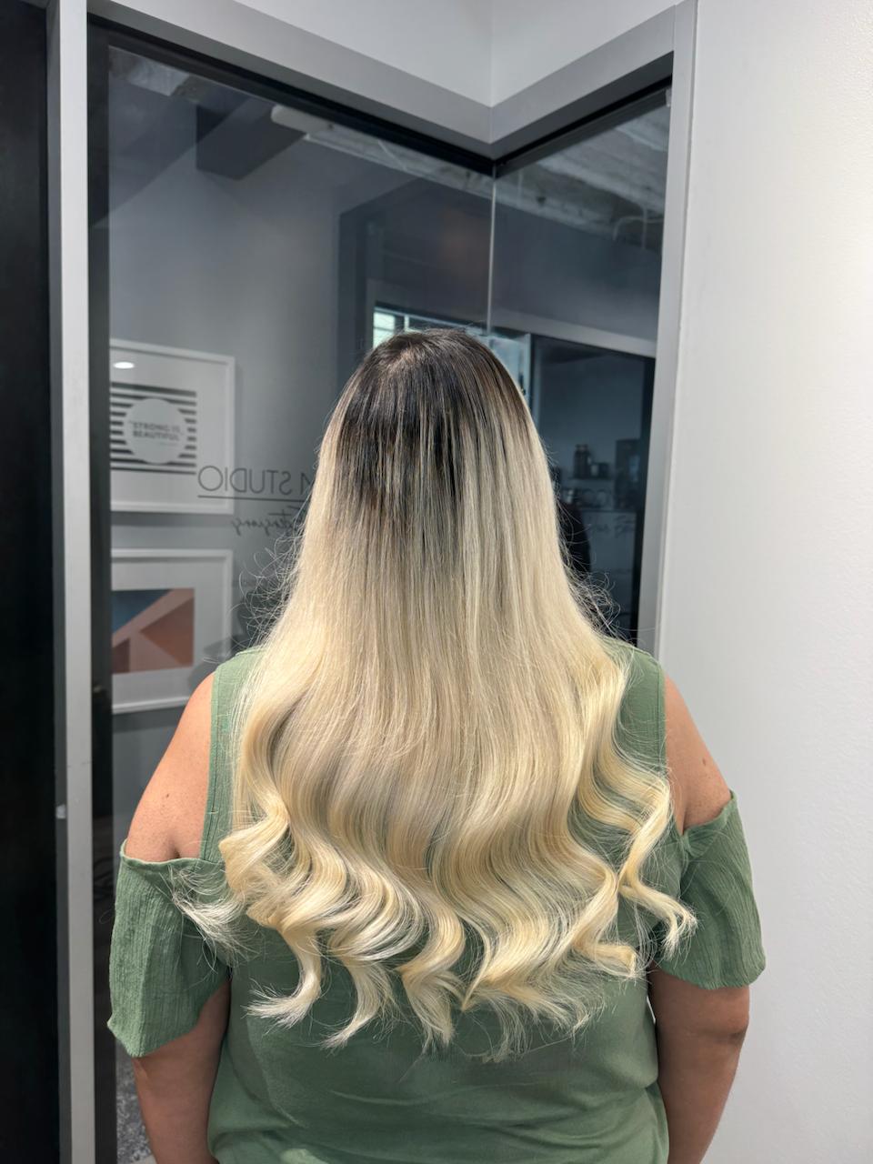 20 inch Ice Fusion Hair Extensions in Houston – bright blonde shade by Bloom Studio Hair Extensions for a soft, voluminous look.