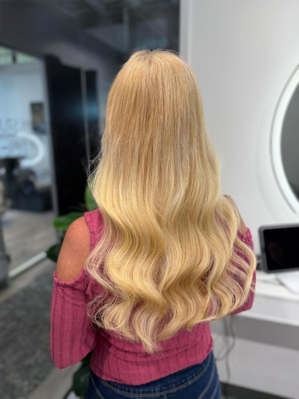 Fresh reinstall of Ice Fusion Hair Extensions at Bloom Studio Houston, showing smooth blonde hair with seamless blend after correction.
