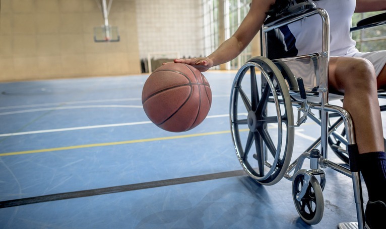 Disabled athlete practices basketball