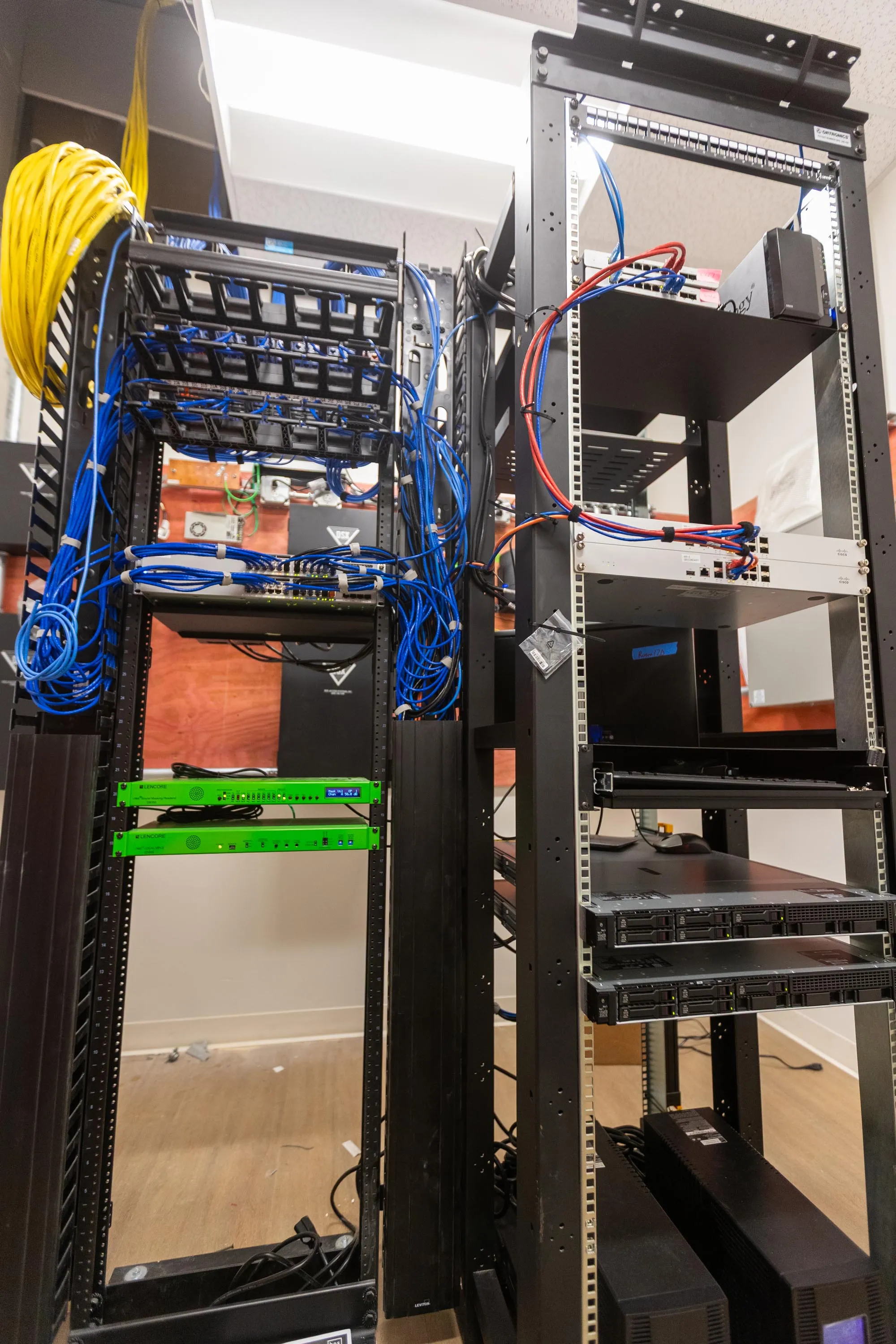 Network and server racks in a finished equipment room