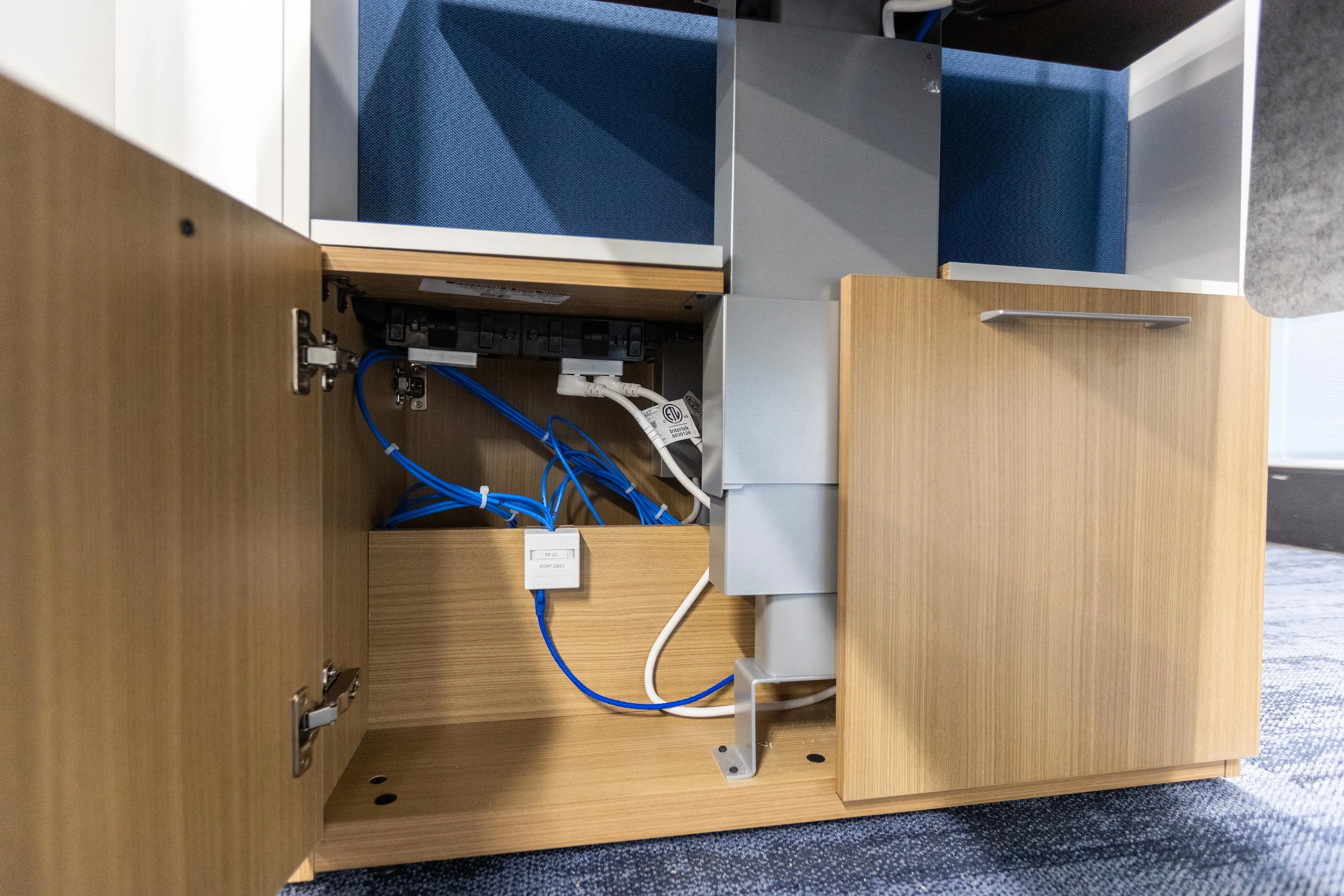 Under-desk data port installed and labeled by Avant