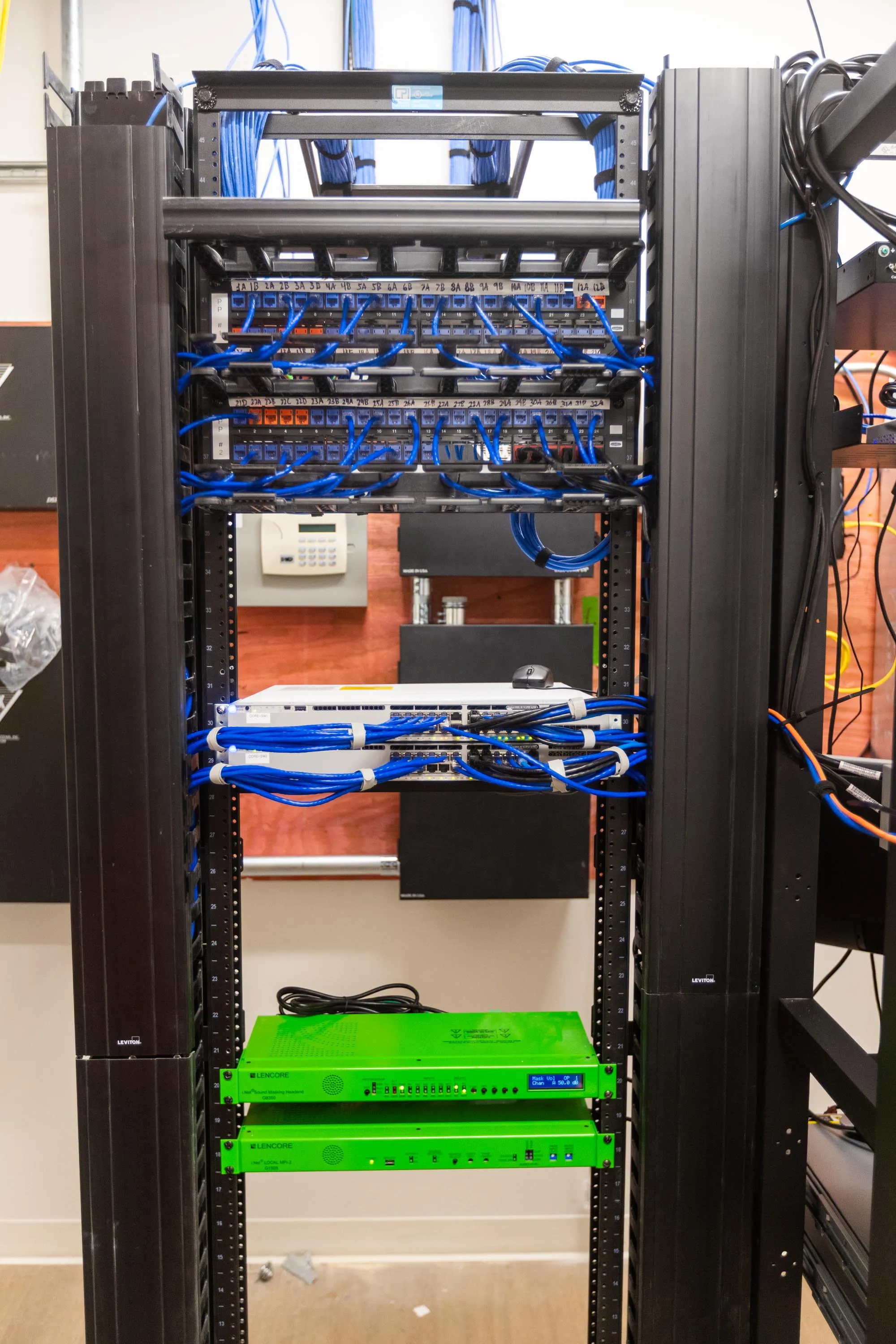 Finished network rack with labeled patch panels