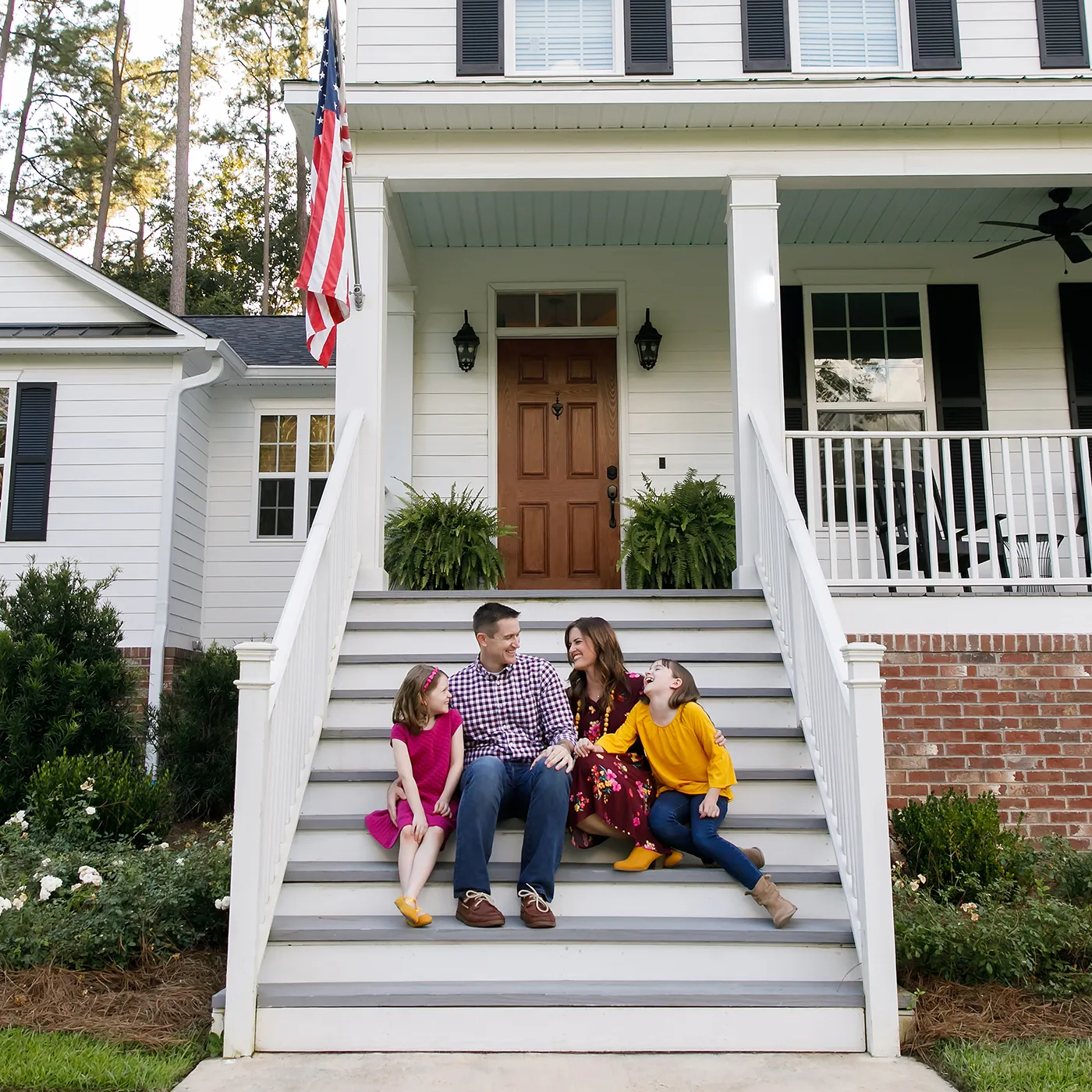 family sitting on stairs