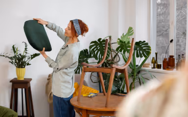 Natural eco-friendly cleaning products including vinegar baking soda and essential oils
