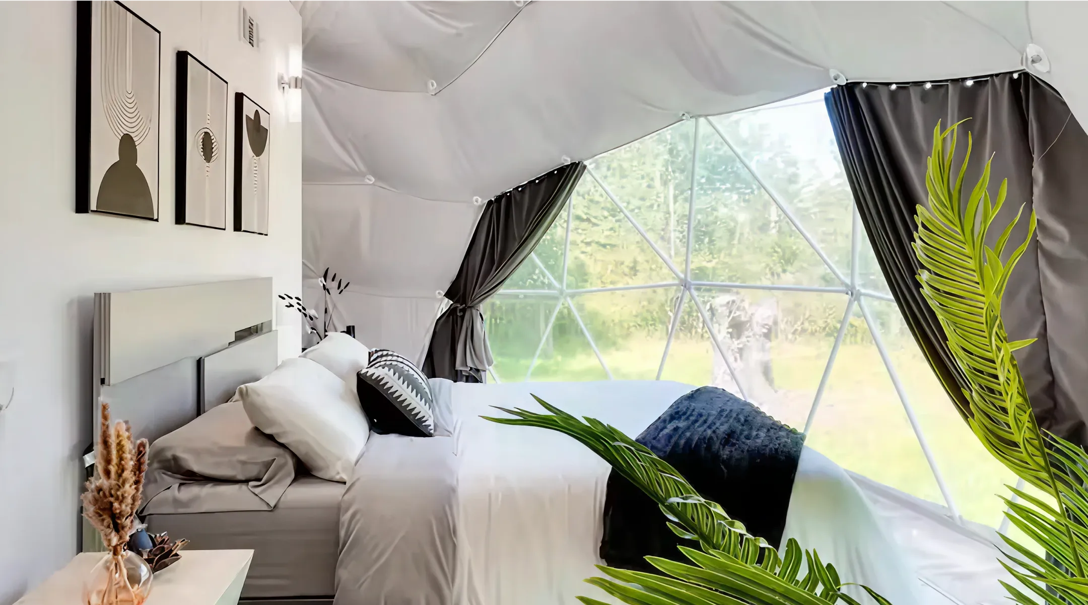 luxury dome bedroom with open curtains and forest view at Unique Escapes NY