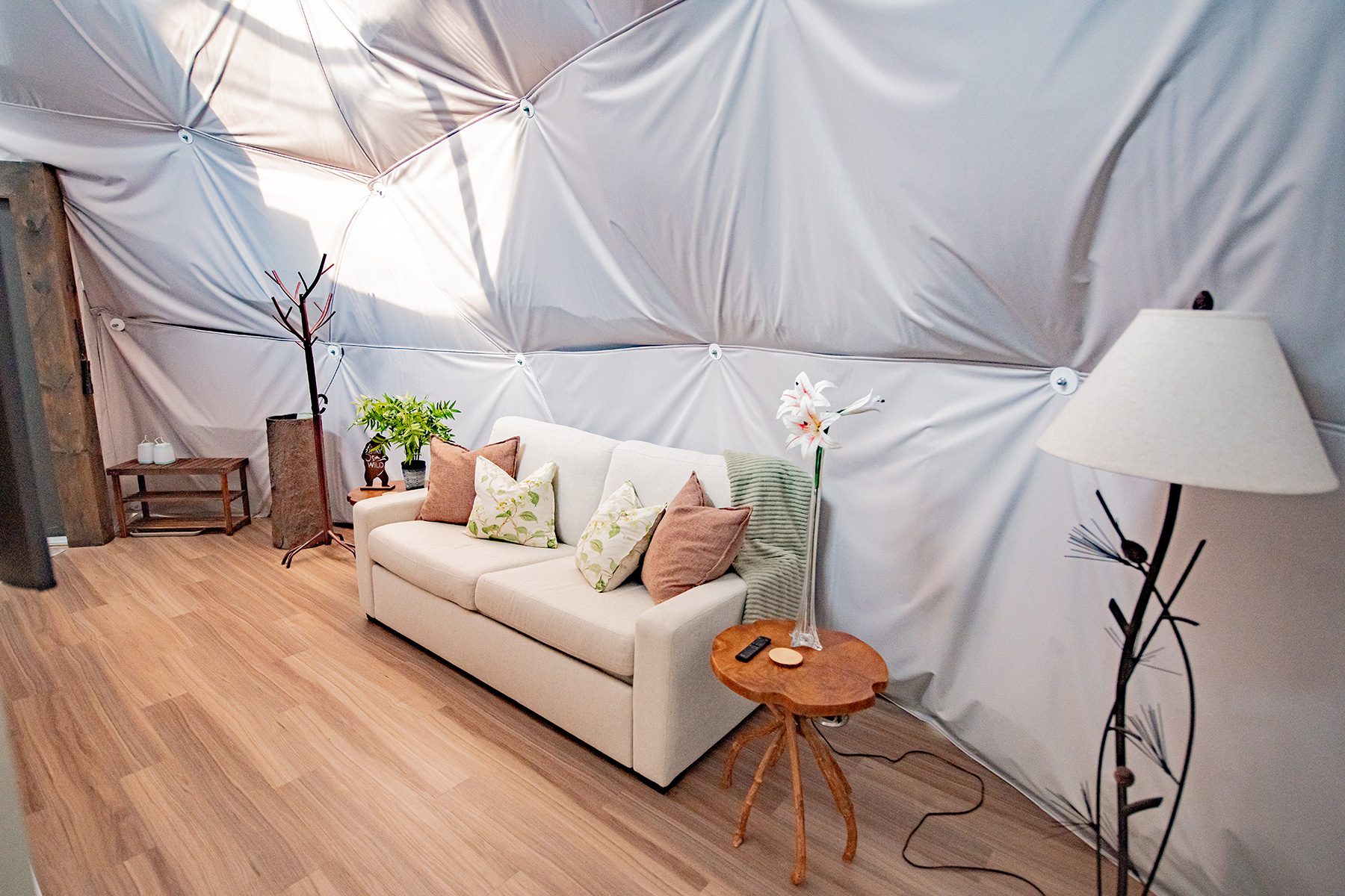 sofa and lamp in bright dome living area at Unique Escapes NY