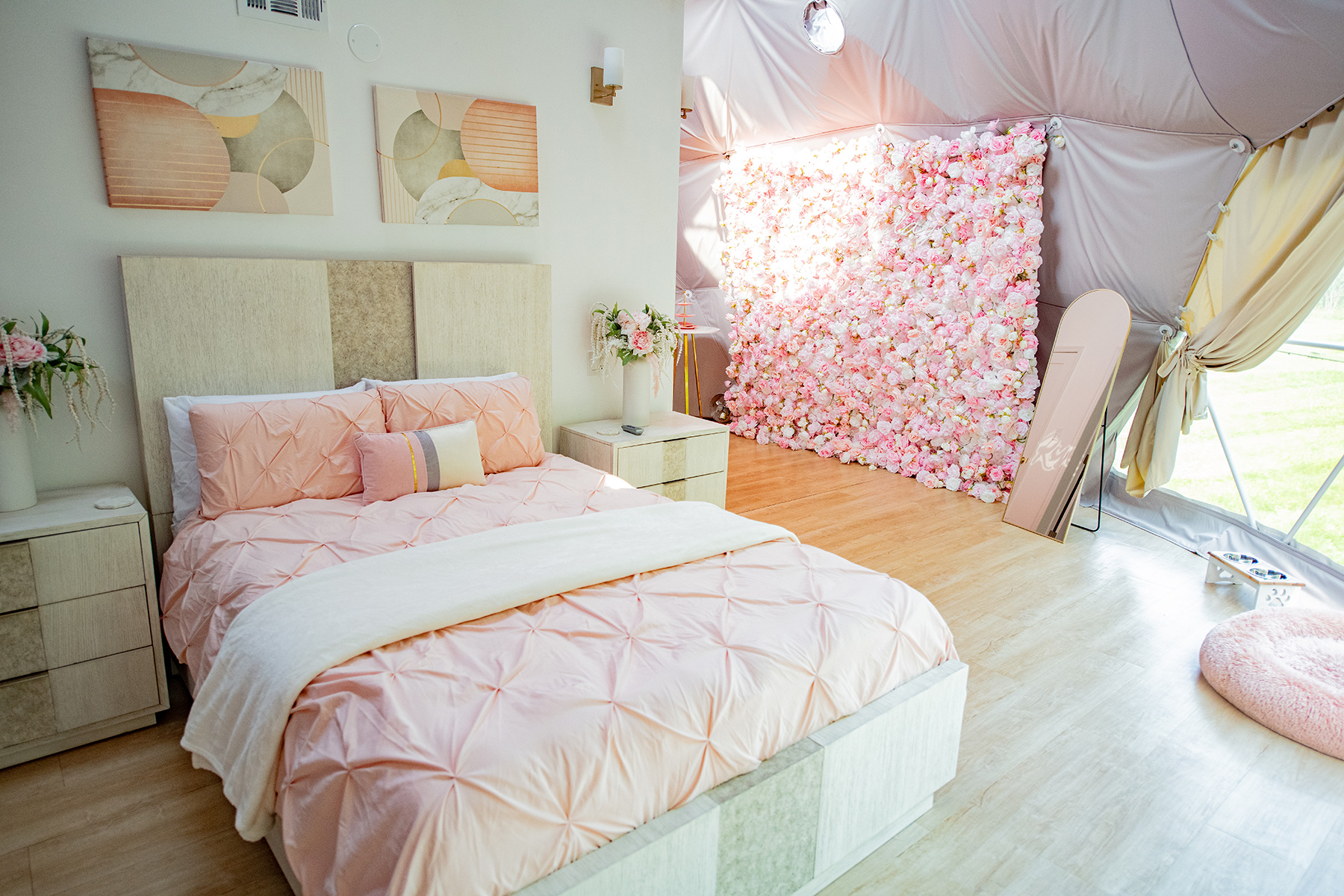 seating area with pink cushions and cozy decor inside dome at Unique Escapes NY