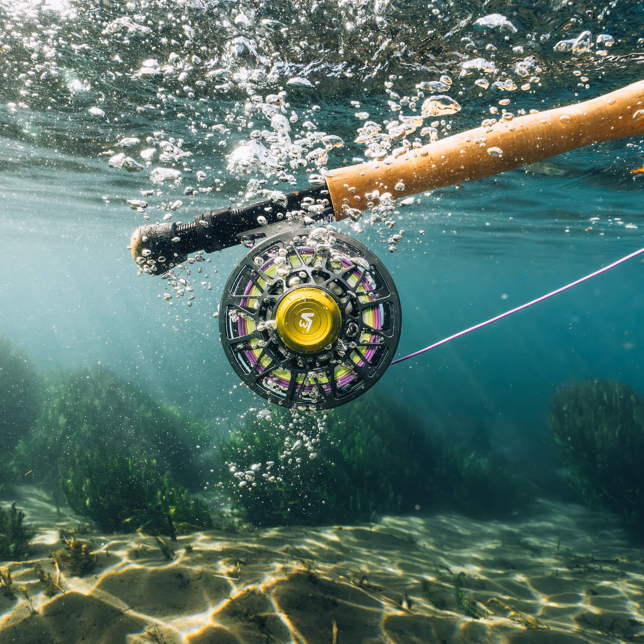 Smartphone displaying custom fishing reel style options next to two fishing reels with river map etchings.