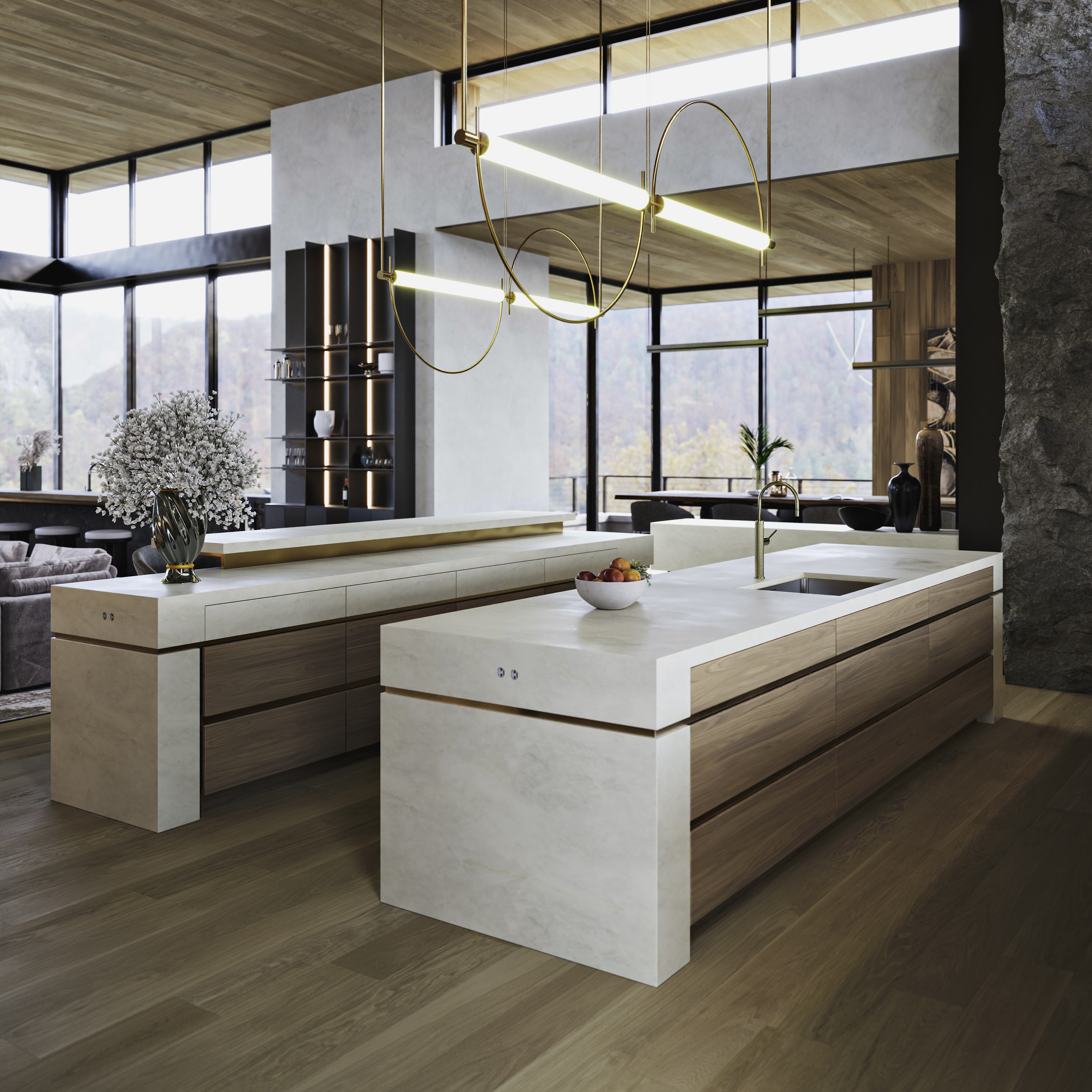 Modern kitchen with large marble and wood island, minimalist hanging lights, and large windows overlooking a forested landscape.