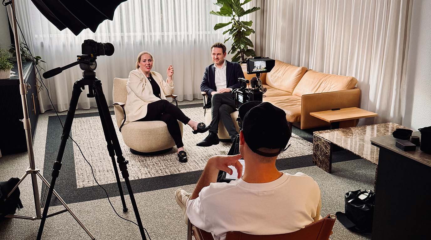 Relaxed two-person interview being filmed by WVFRM