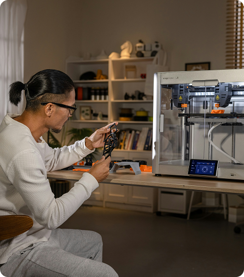 Man making art using 3d printer